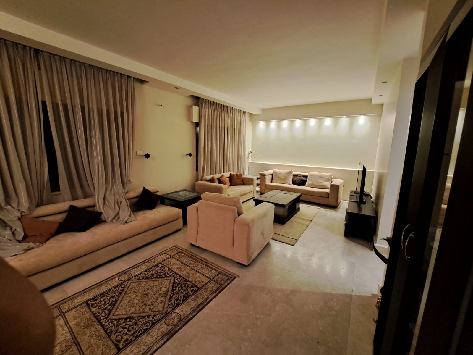 A fourth-floor apartment with a roof, available for rent or sale in Abdoun. - Property Image 6